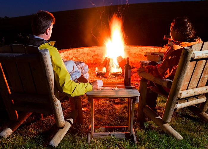 people sitting at a firepit