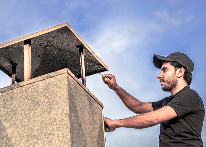 chimney sweep on the roof